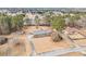 Aerial perspective reveals the property's setting amongst mature trees and landscaping at 345 Wedgefield Dr, Mcdonough, GA 30252