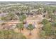 A high aerial view of the house in a neighborhood setting surrounded by trees at 345 Wedgefield Dr, Mcdonough, GA 30252