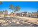 Spacious backyard with brick house, mature trees, and ample space for outdoor activities at 345 Wedgefield Dr, Mcdonough, GA 30252