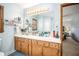 Bathroom features double vanity, blue walls, and a view to the main bedroom at 345 Wedgefield Dr, Mcdonough, GA 30252