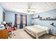 Bedroom with blue walls, decor shelves, window and desk with red chair at 345 Wedgefield Dr, Mcdonough, GA 30252