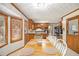 Inviting dining area with a warm wood table set for four, and views of the backyard and kitchen at 345 Wedgefield Dr, Mcdonough, GA 30252