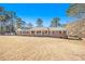 Charming single-story brick home with a manicured front yard and a welcoming front porch at 345 Wedgefield Dr, Mcdonough, GA 30252