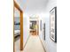Hallway leading to various rooms, with stylish decor, neutral paint, and carpet at 345 Wedgefield Dr, Mcdonough, GA 30252