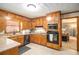 Classic kitchen with wood cabinetry, stainless steel appliances, and ample counter space, perfect for cooking at 345 Wedgefield Dr, Mcdonough, GA 30252