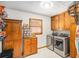 This laundry room features cabinets, a folding station and stainless steel washer and dryer at 345 Wedgefield Dr, Mcdonough, GA 30252