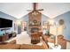 Bright and inviting living room with a brick fireplace, vaulted ceiling, and stylish decor and furnishings at 345 Wedgefield Dr, Mcdonough, GA 30252