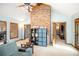 Comfortable living room featuring vaulted ceilings, exposed brick, and ample natural light, creating a relaxed atmosphere at 345 Wedgefield Dr, Mcdonough, GA 30252