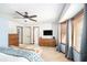 Spacious main bedroom featuring a sitting area, neutral decor, closet and windows at 345 Wedgefield Dr, Mcdonough, GA 30252