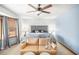 Spacious main bedroom featuring a sitting area, neutral decor and a ceiling fan at 345 Wedgefield Dr, Mcdonough, GA 30252