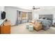 Spacious main bedroom featuring a sitting area, neutral decor and large windows at 345 Wedgefield Dr, Mcdonough, GA 30252