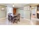 Dining room with hardwood floors, neutral paint, and a view into the kitchen area at 3701 W County Line Rd, Douglasville, GA 30135