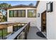 Rear of house with gray back porch and outside dining set at 4217 Paces Ferry Se Rd, Atlanta, GA 30339
