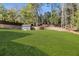 Expansive backyard with well-maintained lawn and retaining wall, offering plenty of space for activities and gardening at 4217 Paces Ferry Se Rd, Atlanta, GA 30339