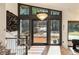 Foyer features a modern chandelier, staircase, open floorplan, and beautiful hardwood floors at 4217 Paces Ferry Se Rd, Atlanta, GA 30339