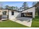 Modern home featuring a sleek garage with a black glass door and spacious driveway, providing ample parking at 4217 Paces Ferry Se Rd, Atlanta, GA 30339