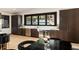Contemporary kitchen boasts stainless steel appliances, sleek countertops, and custom dark wood cabinetry at 4217 Paces Ferry Se Rd, Atlanta, GA 30339