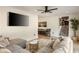 Bright living room featuring a comfortable sectional sofa, hardwood floors, and stairs to the second floor at 4217 Paces Ferry Se Rd, Atlanta, GA 30339