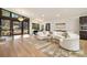 Bright living room with floor-to-ceiling windows, modern lighting, and a spacious seating area at 4217 Paces Ferry Se Rd, Atlanta, GA 30339