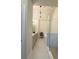 Modern bathroom with stylish lighting, double vanity, glass shower, and neutral color palette at 1411 Wisteria Wall Dr, Suwanee, GA 30024