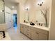 Elegant bathroom with double vanity, marble countertops, modern fixtures, and natural light at 1411 Wisteria Wall Dr, Suwanee, GA 30024