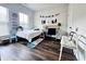 Bright bedroom with dark floors, decorated with car-themed items and gaming-inspired elements for a playful touch at 1411 Wisteria Wall Dr, Suwanee, GA 30024