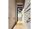 Inviting front door with a wreath and a welcome mat on a brick pathway at 1411 Wisteria Wall Dr, Suwanee, GA 30024