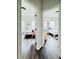 View of adjacent bedrooms featuring coordinated flooring and decor, illustrating the home's cohesive design at 1411 Wisteria Wall Dr, Suwanee, GA 30024