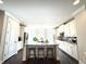 Spacious kitchen island with granite countertops and modern stainless steel appliances at 1411 Wisteria Wall Dr, Suwanee, GA 30024