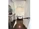 Stylish staircase with paneled walls and bench seating leading to the upper level at 1411 Wisteria Wall Dr, Suwanee, GA 30024