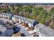 Extensive aerial view of a townhome community surrounded by a lush tree canopy at 3180 Spicy Cedar Ln, Lithonia, GA 30038