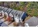 Aerial view of a charming townhome community with lush landscaping at 3180 Spicy Cedar Ln, Lithonia, GA 30038