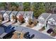 Aerial view of a well-maintained townhome community with tree-lined streets in a suburban area at 3180 Spicy Cedar Ln, Lithonia, GA 30038