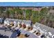Expansive aerial view of a well-maintained townhome community surrounded by mature trees at 3180 Spicy Cedar Ln, Lithonia, GA 30038