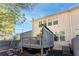 View of the back deck and fenced yard of this lovely townhome with lots of windows at 3180 Spicy Cedar Ln, Lithonia, GA 30038