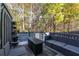 Relaxing deck with seating and trees in backyard at 3180 Spicy Cedar Ln, Lithonia, GA 30038