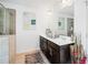 Bathroom featuring a double sink vanity, and a glass shower at 3180 Spicy Cedar Ln, Lithonia, GA 30038
