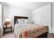 Comfortable bedroom with a queen-size bed, side table, and lamps, perfect for relaxation at 3180 Spicy Cedar Ln, Lithonia, GA 30038
