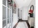 Bright foyer featuring hardwood floors, a stylish mirror, and elegant decor at 3180 Spicy Cedar Ln, Lithonia, GA 30038