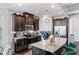 Modern kitchen features granite countertops, stainless steel appliances, and ample cabinet space at 3180 Spicy Cedar Ln, Lithonia, GA 30038