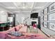 Open-concept living area with a fireplace, TV, and seamless flow to the kitchen at 3180 Spicy Cedar Ln, Lithonia, GA 30038