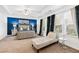Spacious main bedroom with tray ceilings, a sitting area, and ample natural light at 3180 Spicy Cedar Ln, Lithonia, GA 30038