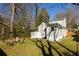 Expansive backyard featuring green grass, mature trees, and a charming home exterior at 731 Hobart Se Ave, Atlanta, GA 30312
