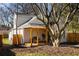 Backyard featuring home exterior, wooden deck, privacy fence, with mature trees providing shade at 731 Hobart Se Ave, Atlanta, GA 30312