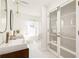 Bright bathroom with double vanities, modern fixtures, and stylish glass shower at 731 Hobart Se Ave, Atlanta, GA 30312