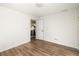 Bright bedroom with light colored wood flooring and white walls, showing open door to the kitchen at 731 Hobart Se Ave, Atlanta, GA 30312