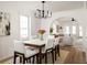 Bright dining room featuring a modern chandelier and open floorplan at 731 Hobart Se Ave, Atlanta, GA 30312