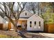 Charming bungalow with a welcoming front porch and modern gray siding, complemented by a neatly landscaped yard at 731 Hobart Se Ave, Atlanta, GA 30312