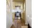 Cozy kitchen features stainless steel range, white cabinets, and warm wood flooring at 731 Hobart Se Ave, Atlanta, GA 30312