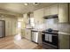 Kitchen featuring stainless steel appliances, lots of cabinets and hardwood floors at 731 Hobart Se Ave, Atlanta, GA 30312